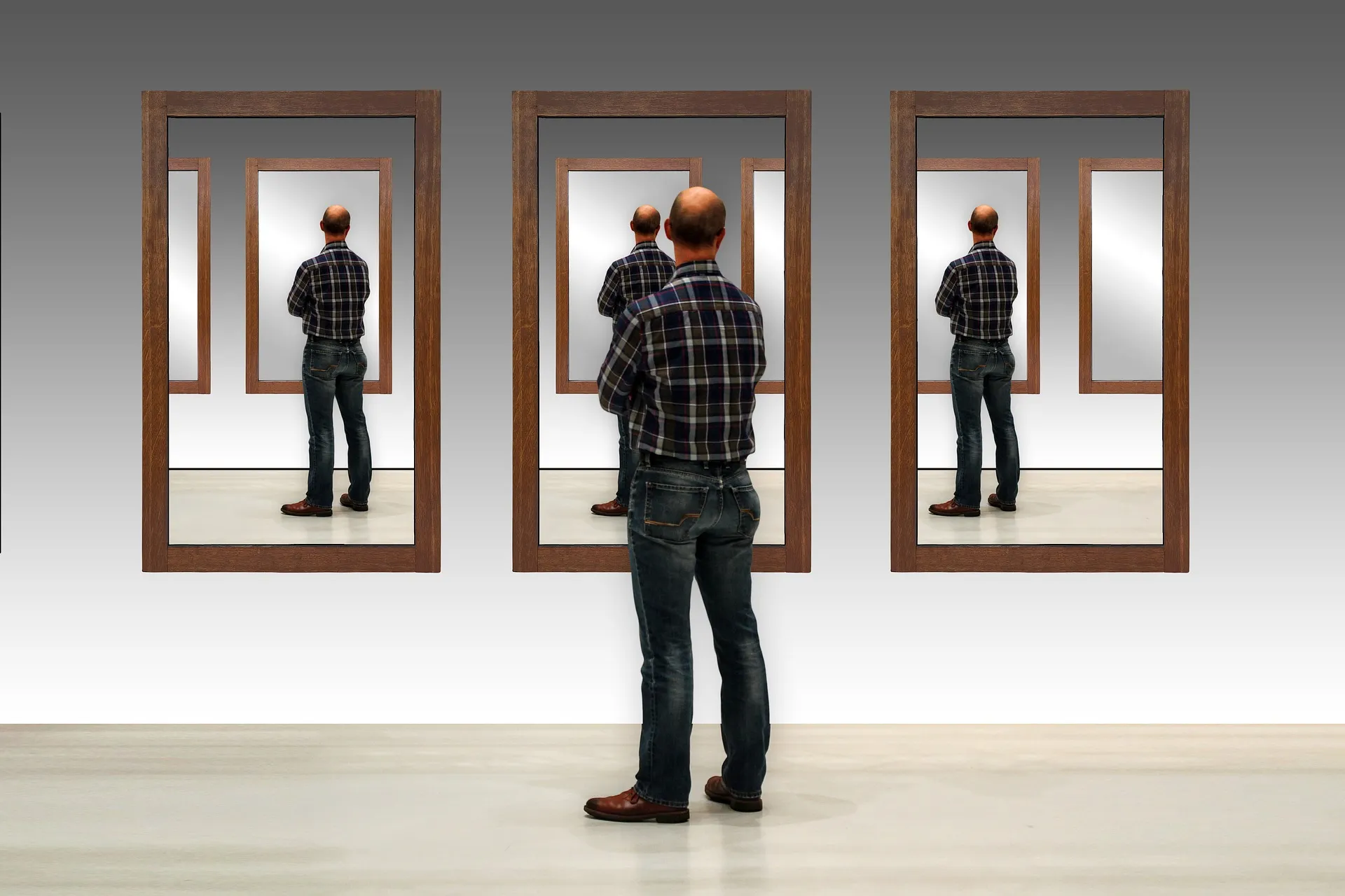 Man standing in front of mirrors